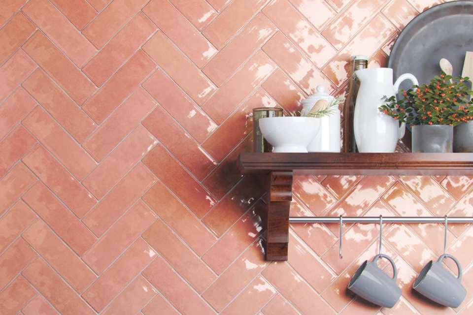 salmon colored glazed porcelain tile backsplash in modern kitchen